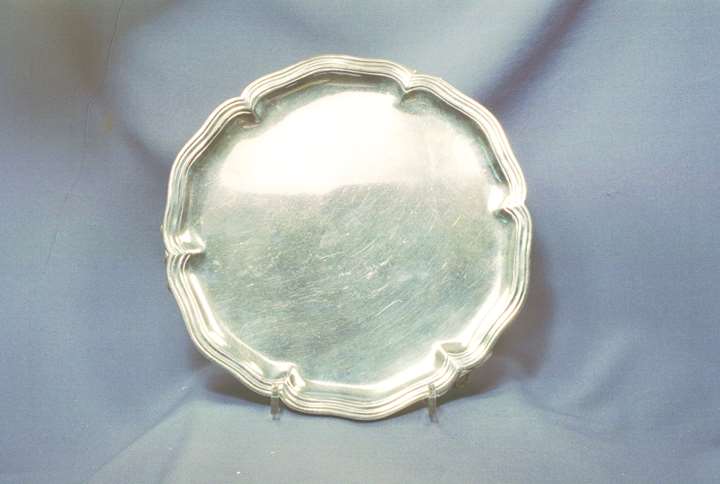 Antique Spanish silver shaped circular salver, maker's mark M G, Madrid, c.1770, with reeded border and standing on three shell and scroll feet